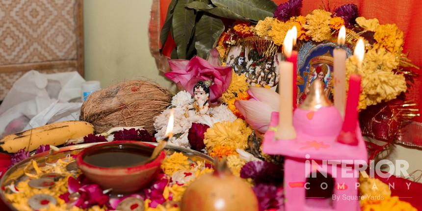 Modern Pooja unit with flower decorations